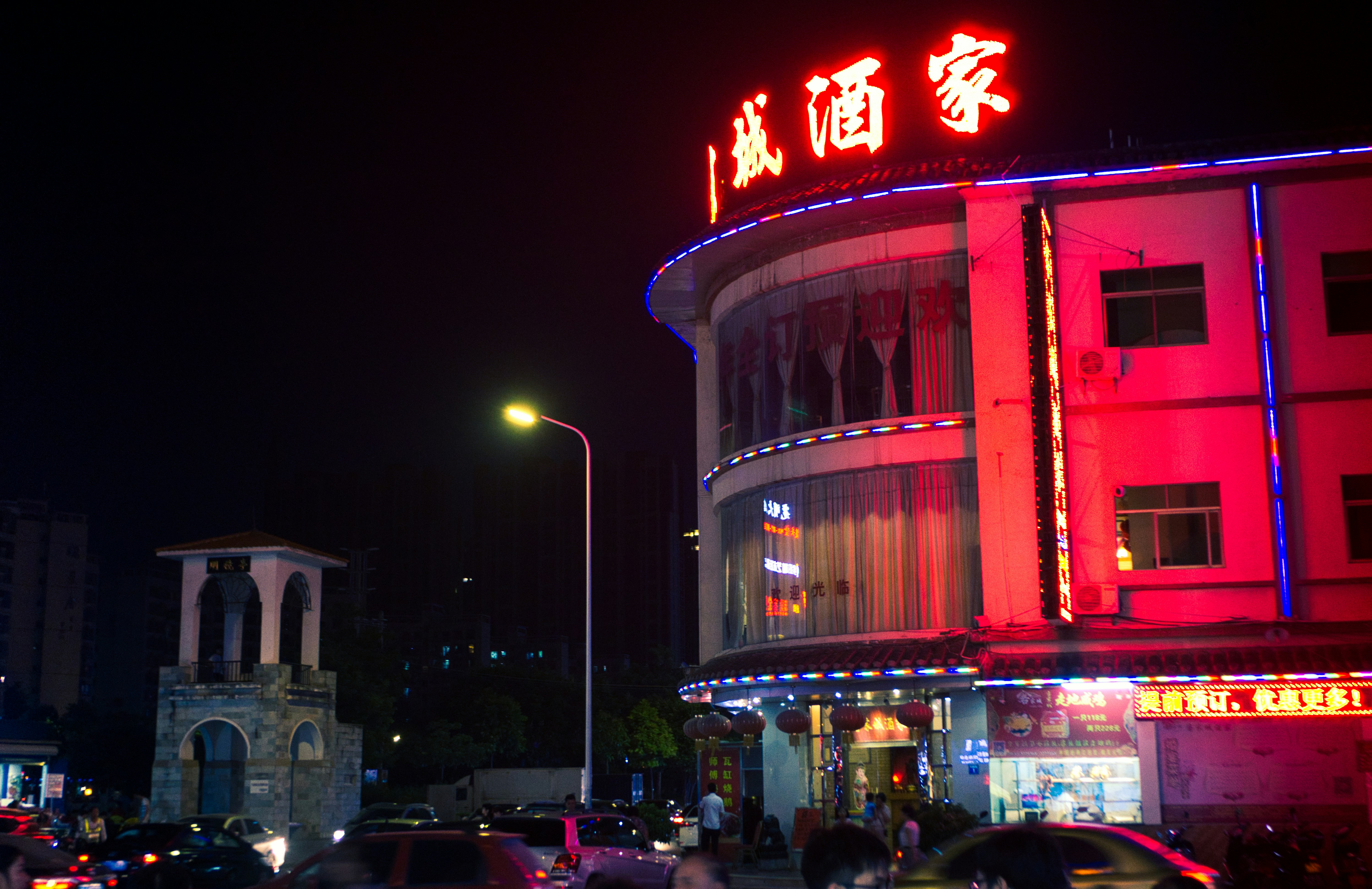 cars parked in front of building during night time