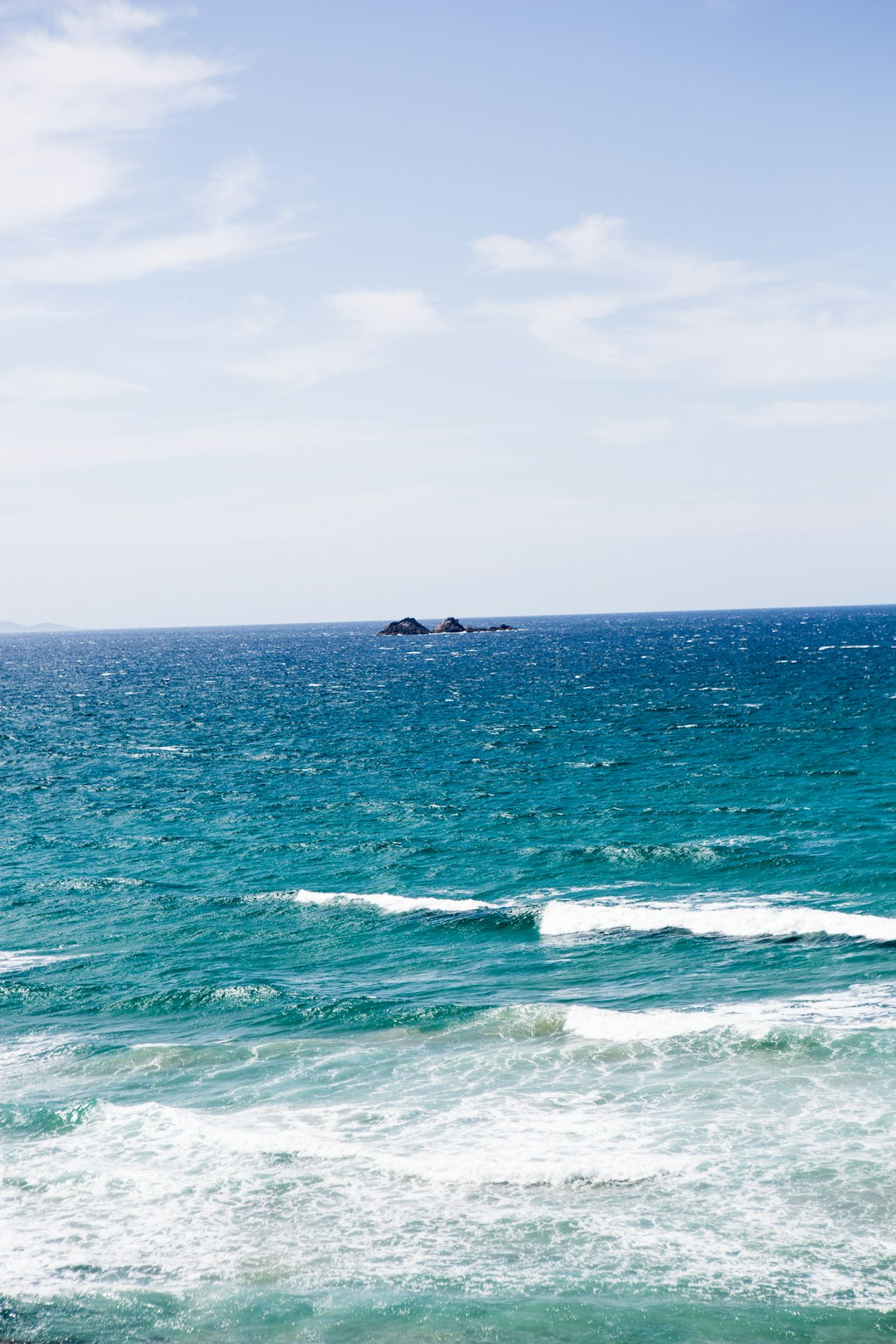 person surfing on sea waves during daytime