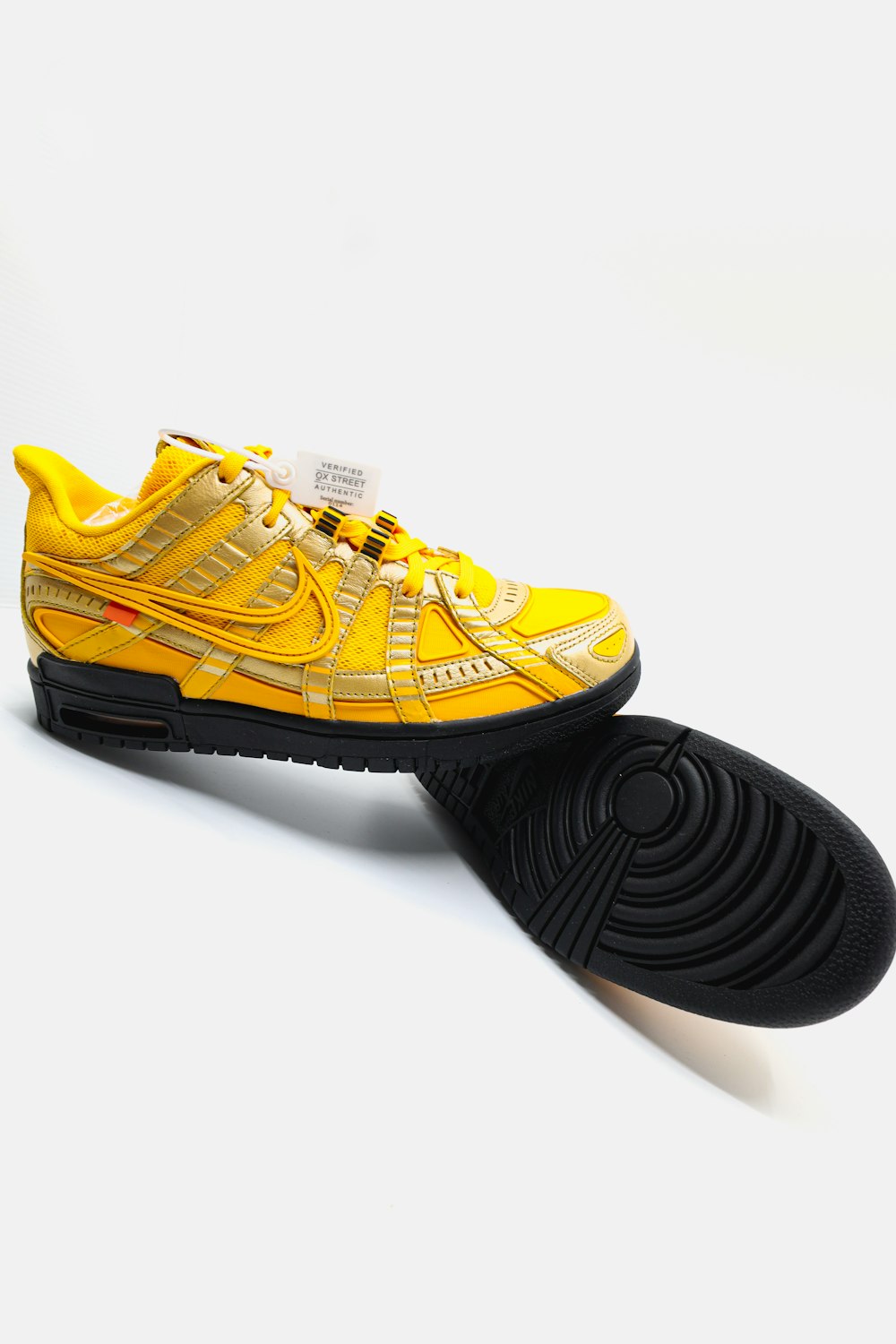 black and yellow adidas athletic shoes