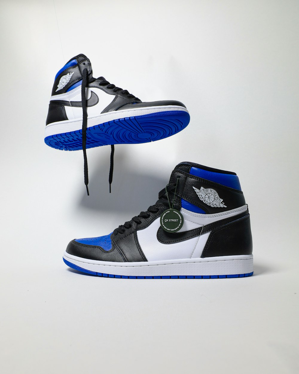 blue and black nike high top sneakers