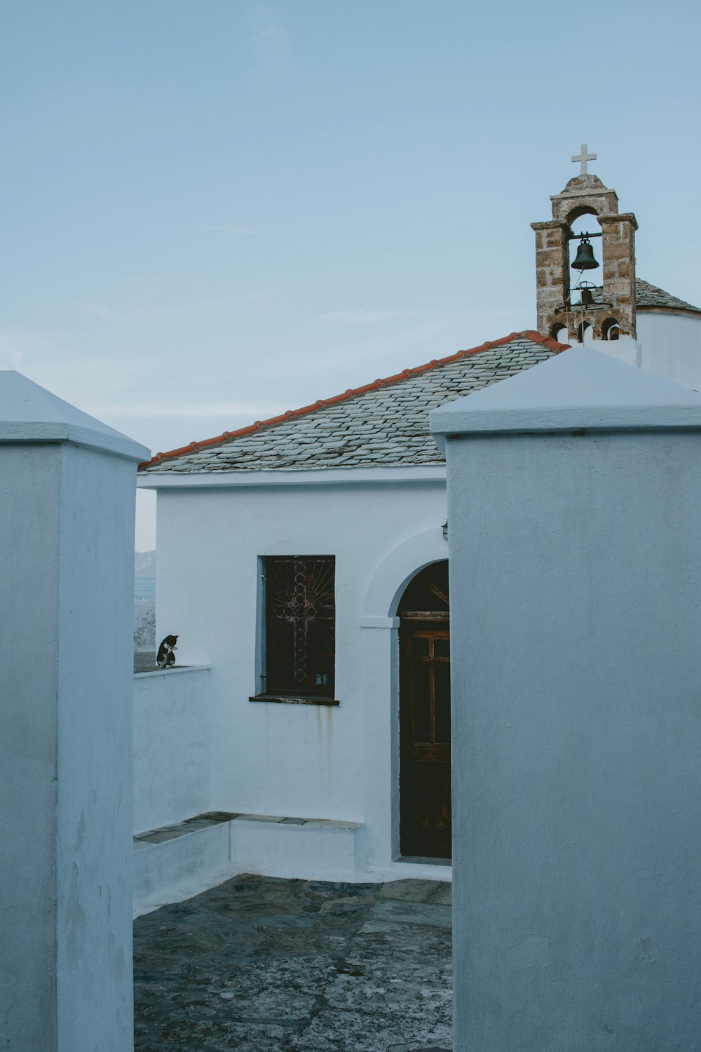 white concrete building with brown roof