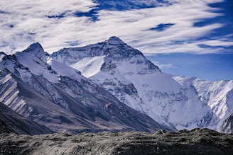 snow covered mountains under blue sky during daytime