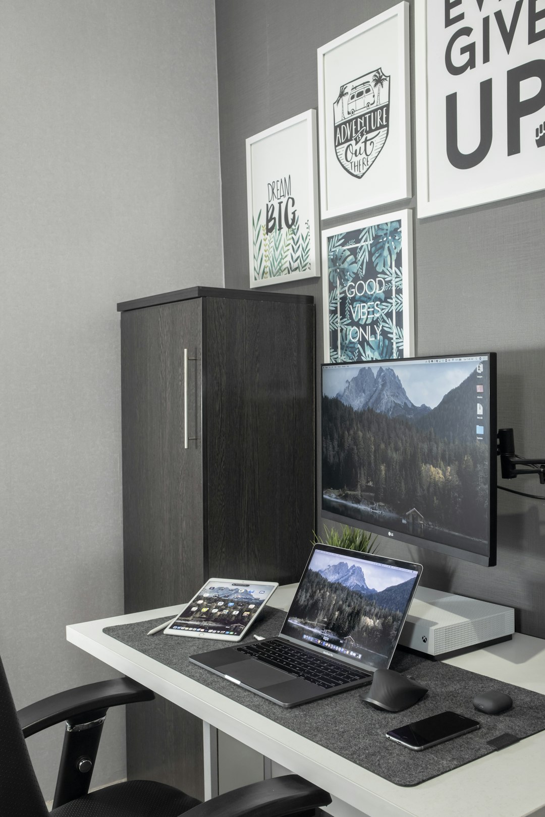 black and silver laptop computer on white table