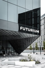 people walking on sidewalk near building during daytime