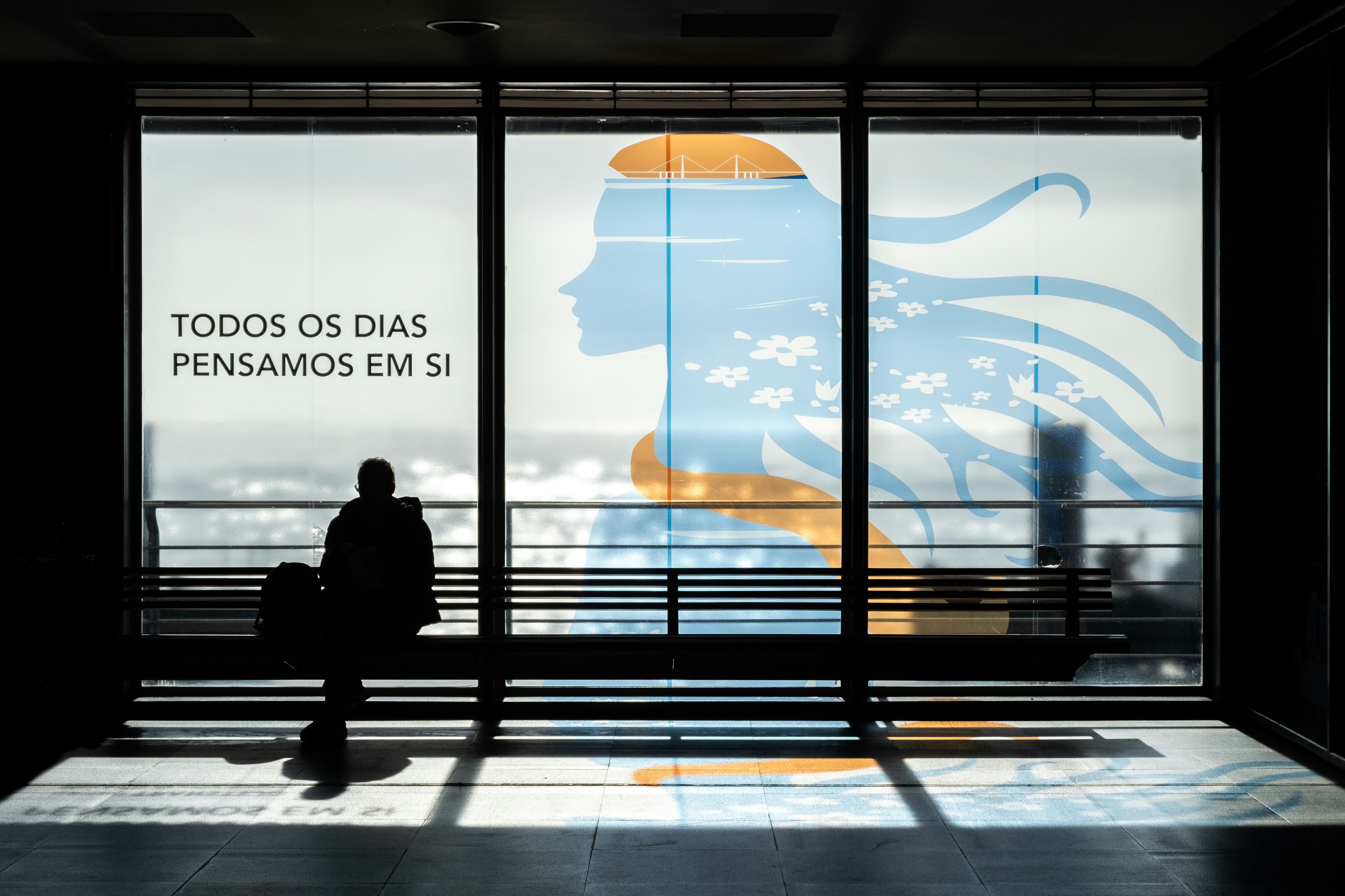 Silhouette of a man sitting on a bench, Branimo blog illustration.