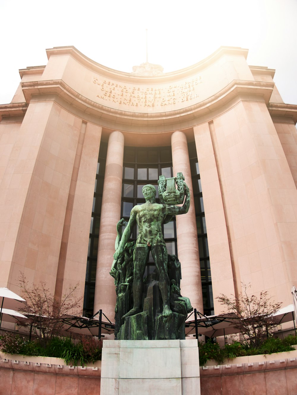 green statue of man in green robe