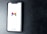 A smartphone with a white screen displays the Gmail logo, positioned on a textured dark background, with the Google branding at the bottom of the screen.