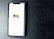 A smartphone with a white screen displays the Gmail logo, positioned on a textured dark background, with the Google branding at the bottom of the screen.