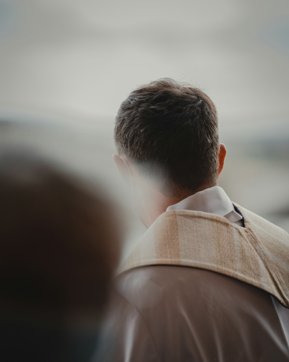 man in brown collared shirt