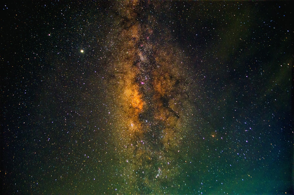green and brown sky with stars