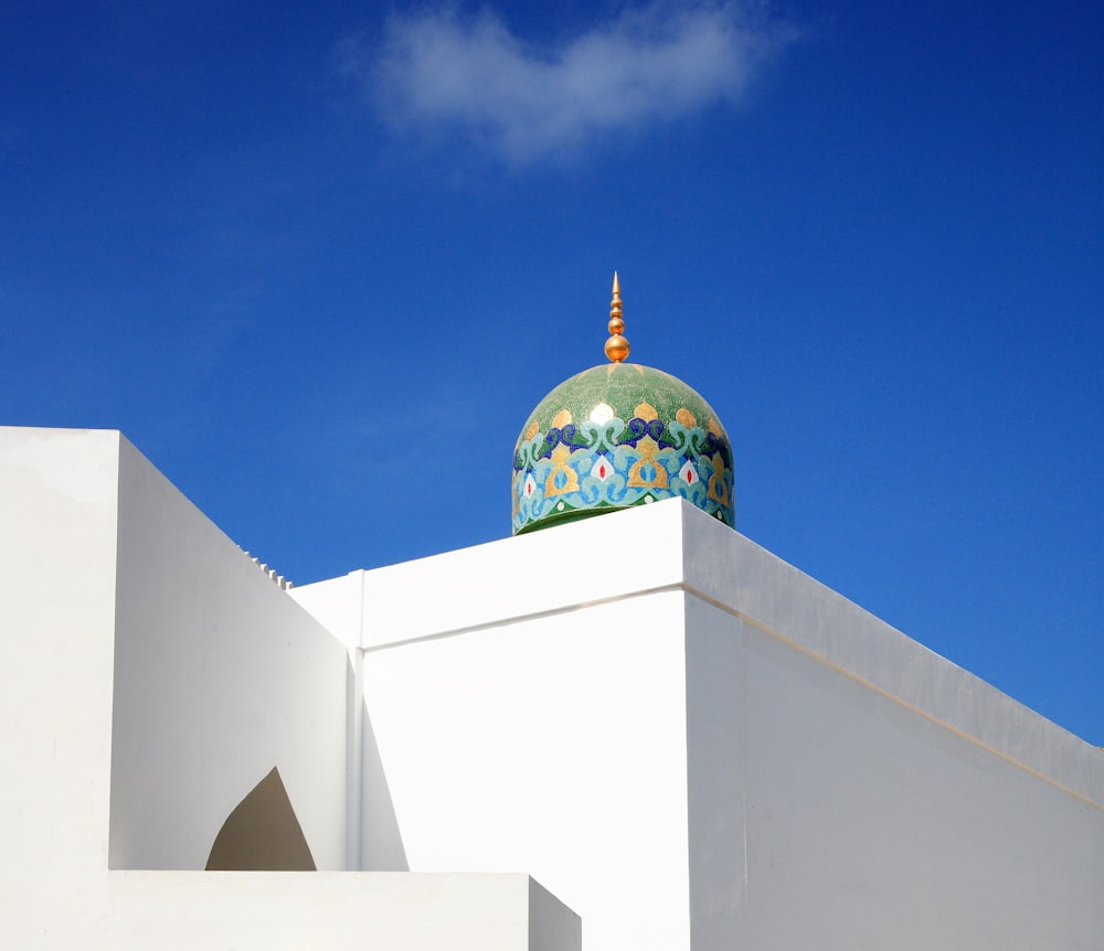 white and gold dome building under blue sky during daytime