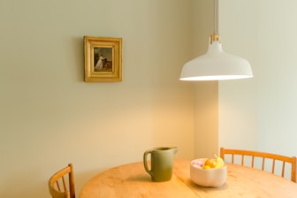 white ceramic mug on brown wooden table