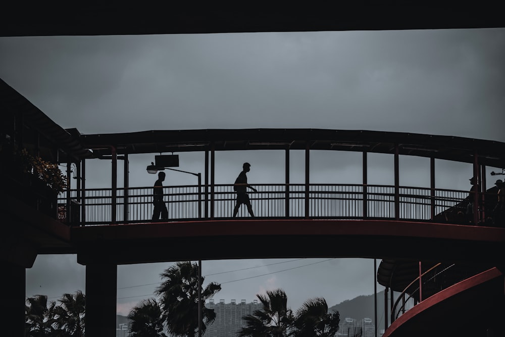 man standing on a bridge