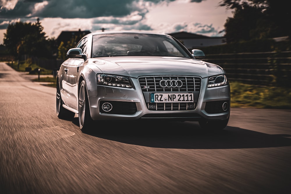 silver audi a 4 on a sunny day