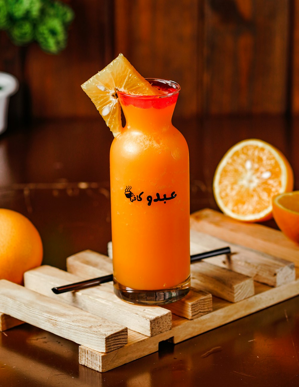 orange juice in clear drinking glass