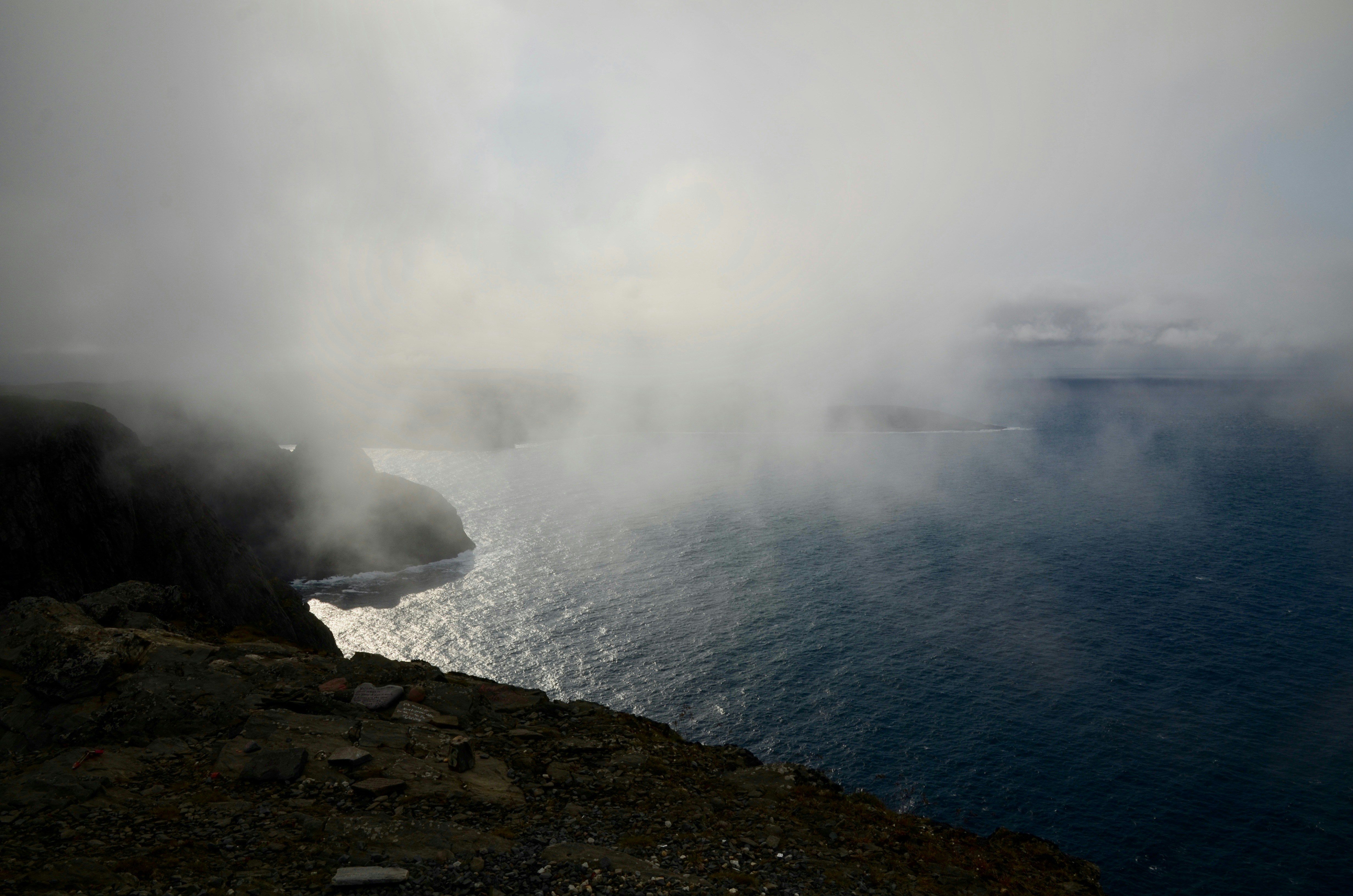 water waves hitting rocks during daytime