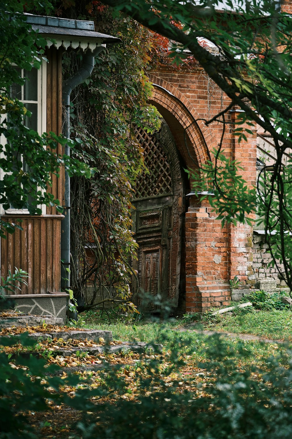 an old brick building with a wooden door