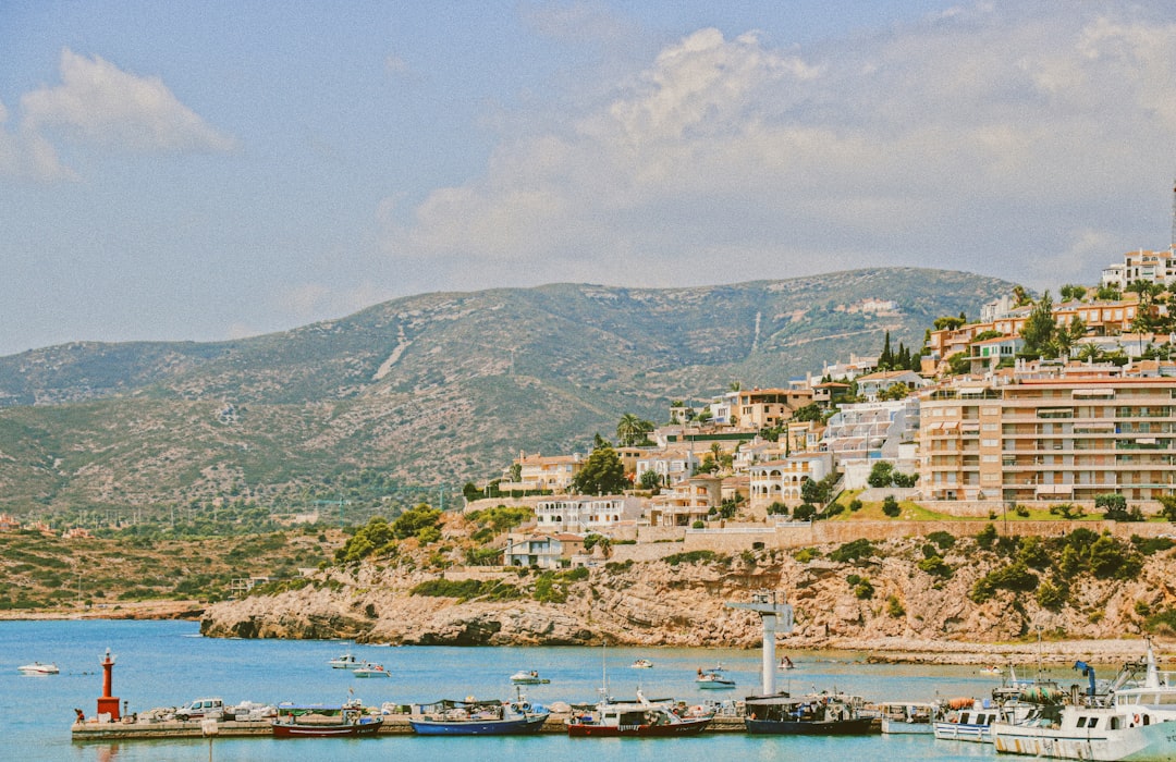 white and brown concrete buildings near body of water during daytime, Where the wilderness meets the life.