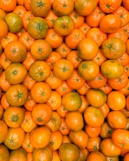 orange fruits on white ceramic plate