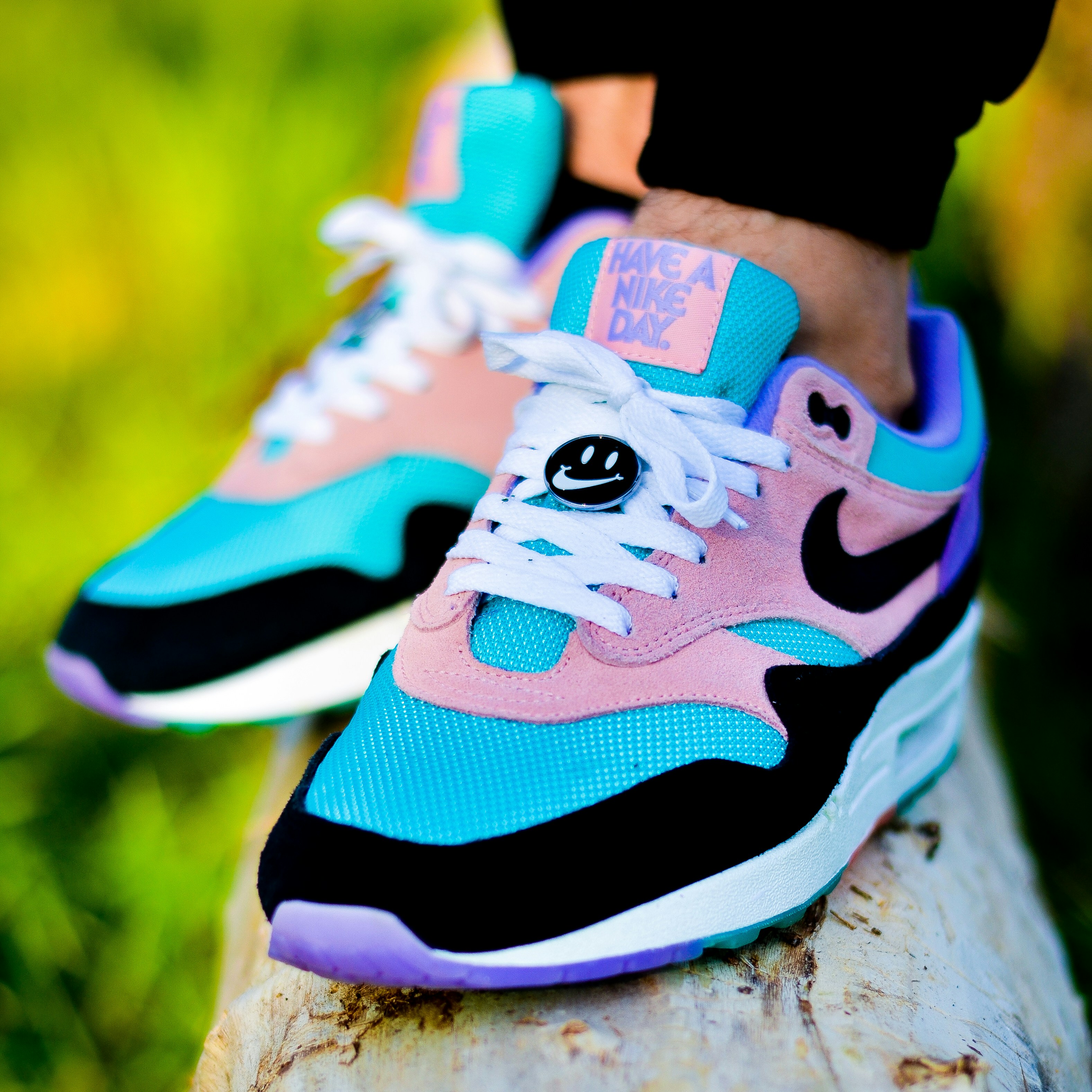person wearing blue white and black nike athletic shoes