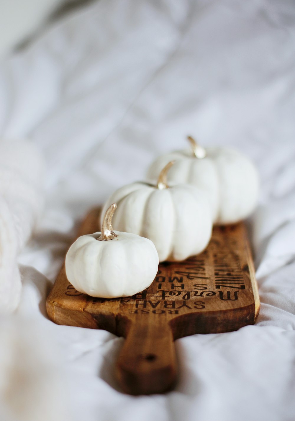 white garlic on brown wooden chopping board