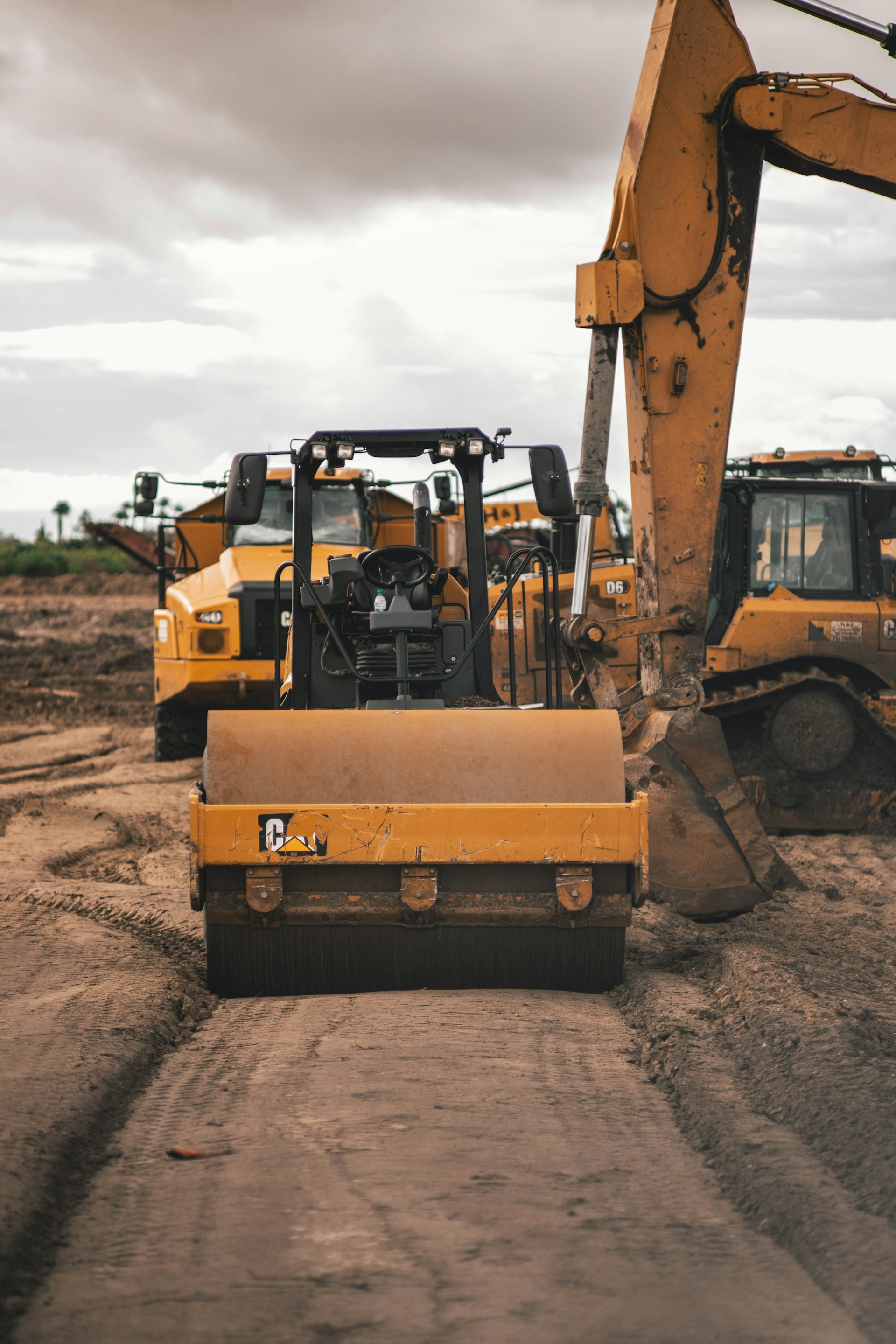 Construction excavator and heavy machinery at work site - EquipEASE construction equipment financing in Canada