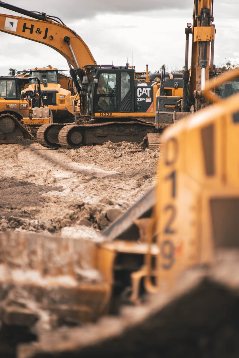 An excavator digging into soil