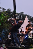 A vibrant illustration of a saxophonist playing passionately on stage.