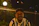 Smiling locksmith technician helping a customer at night in Manhattan