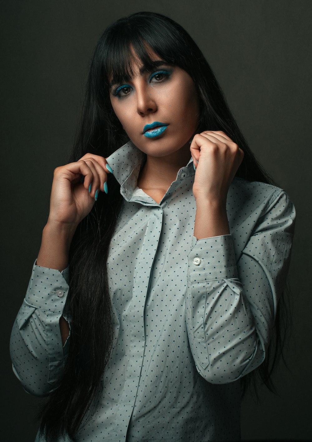 woman in gray button up long sleeve shirt