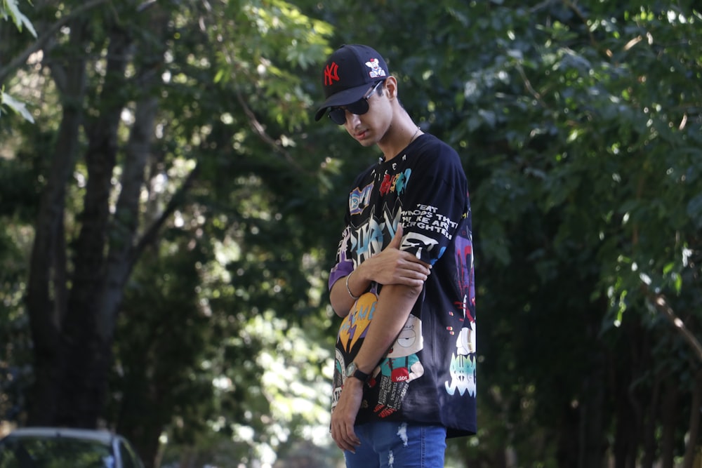 a young man standing on a skateboard holding a cell phone