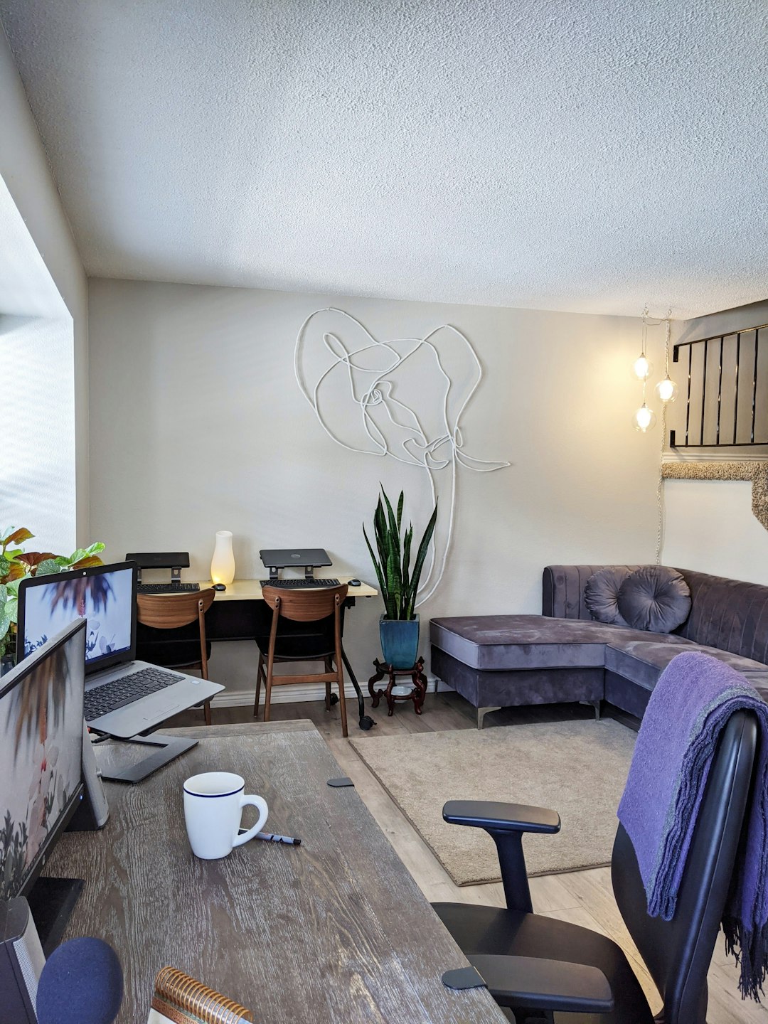 gray sofa near brown wooden table