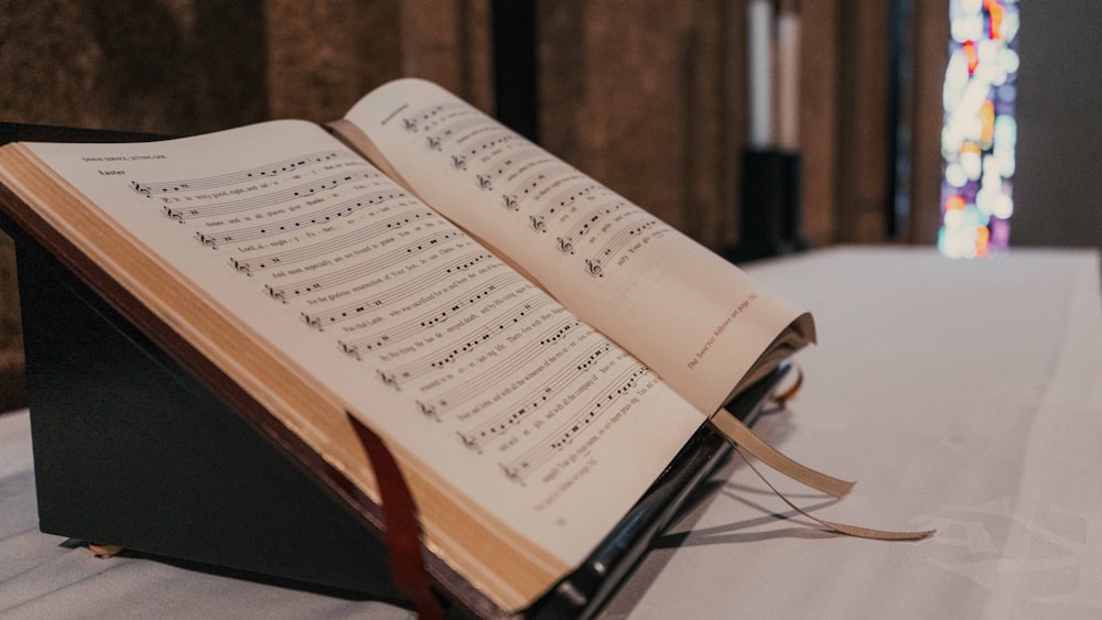 white book page on brown wooden table