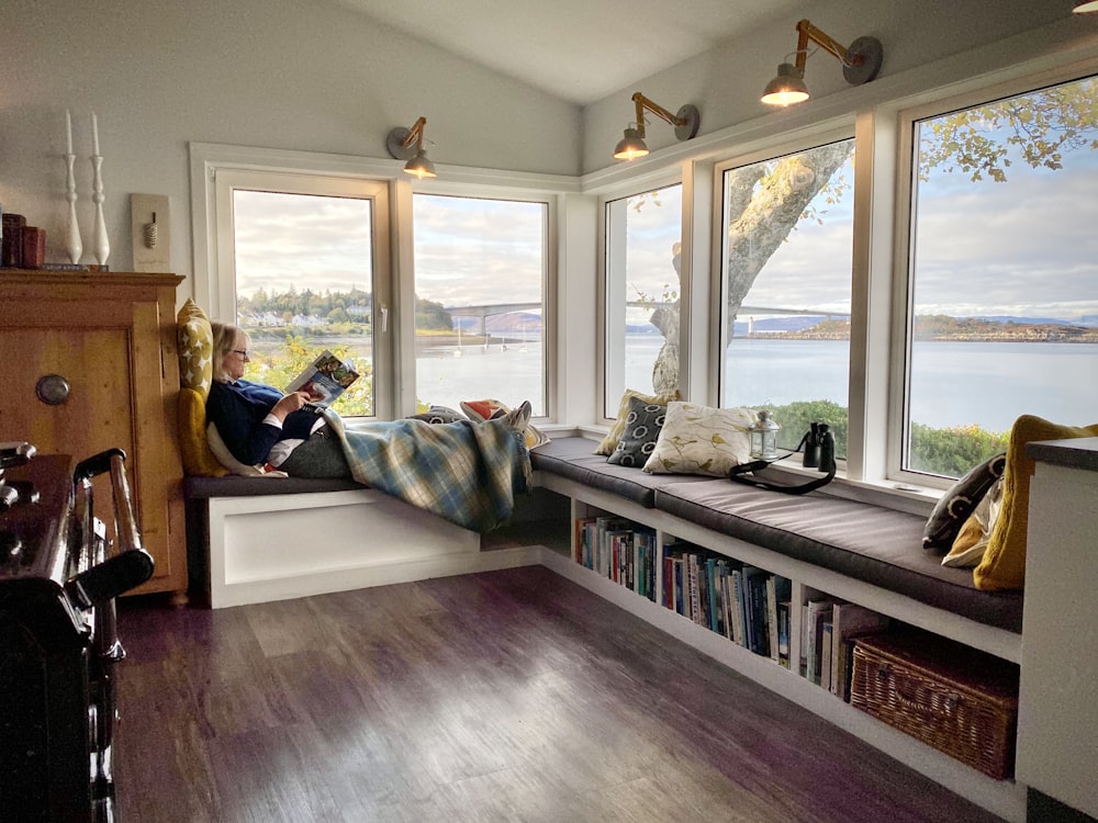 white and gray bed near window