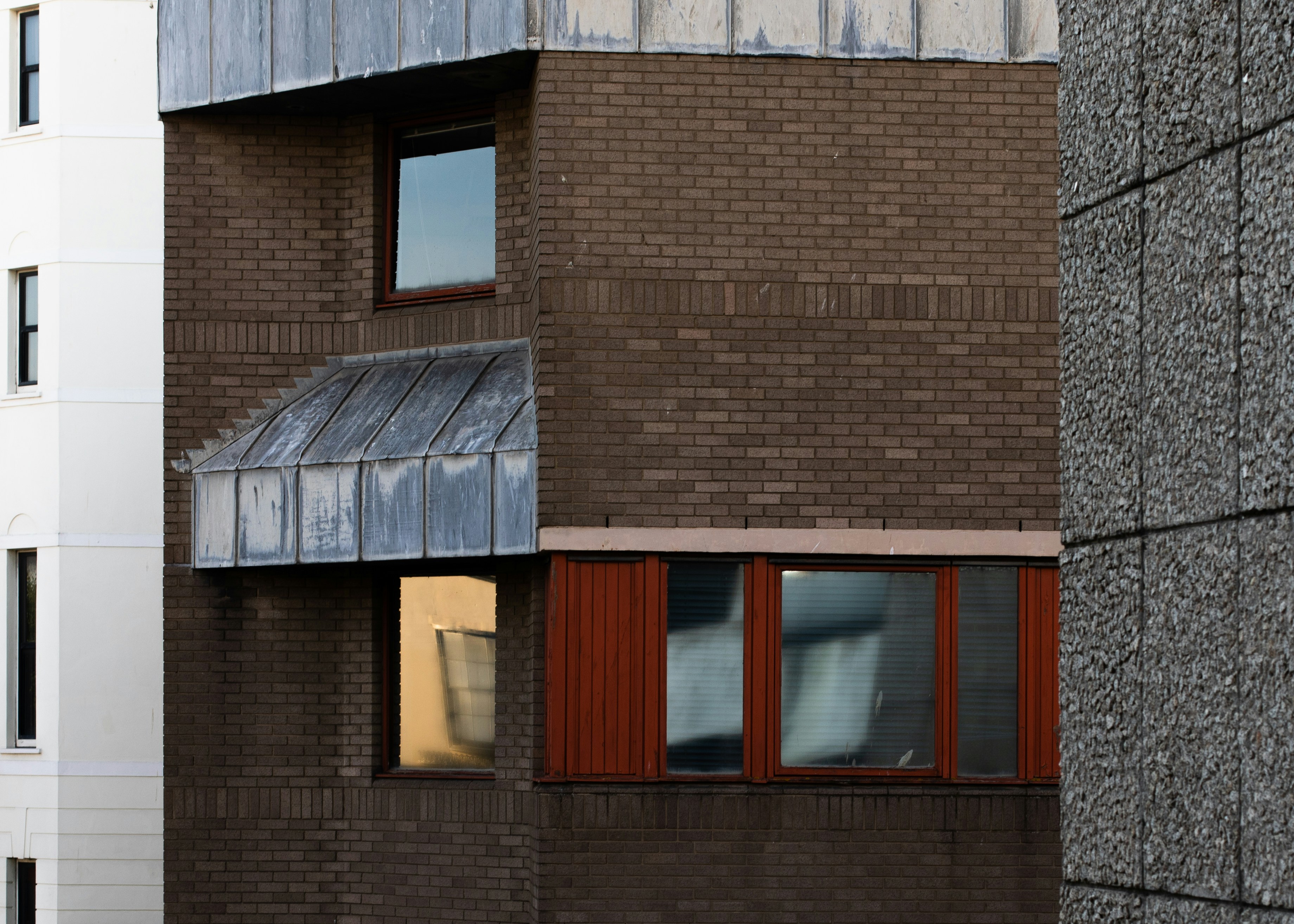 brown brick building with windows