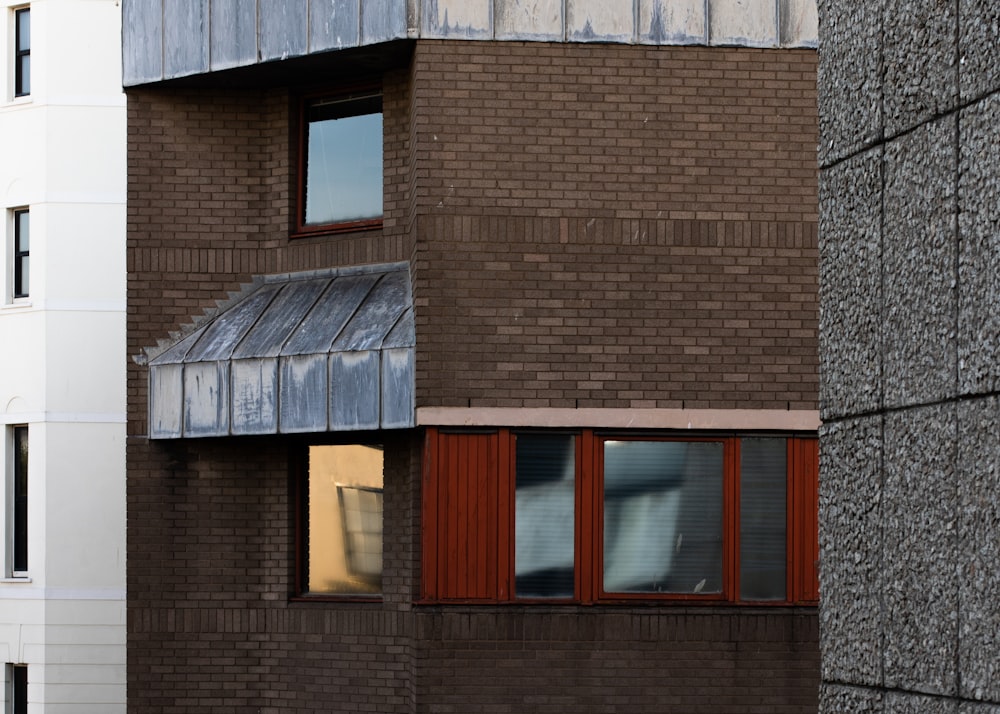 brown brick building with windows