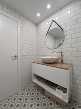 white ceramic sink with stainless steel faucet