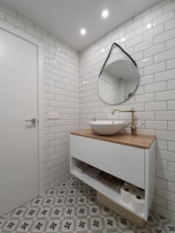white ceramic sink with stainless steel faucet