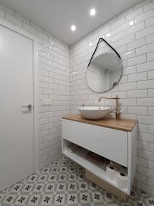 white ceramic sink with stainless steel faucet