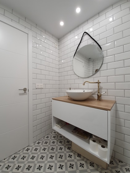 white ceramic sink with stainless steel faucet