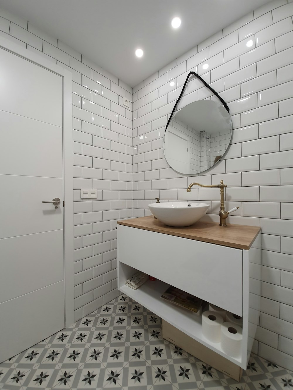 white ceramic sink with stainless steel faucet