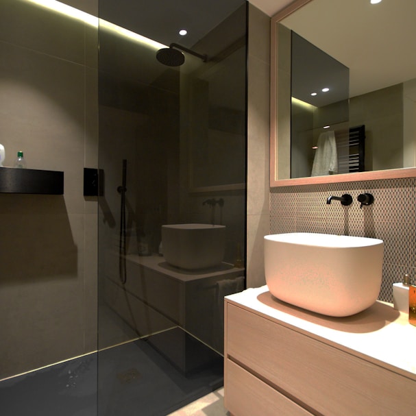 white ceramic sink near mirror