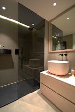 white ceramic sink near mirror