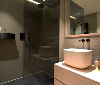 white ceramic sink near mirror