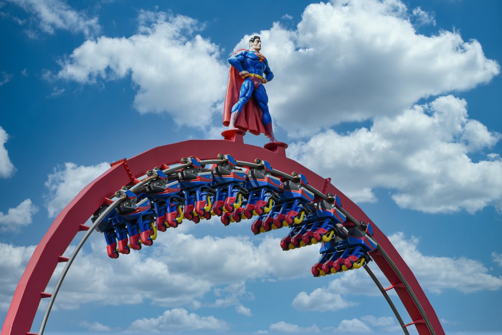 red and blue statue under blue sky during daytime