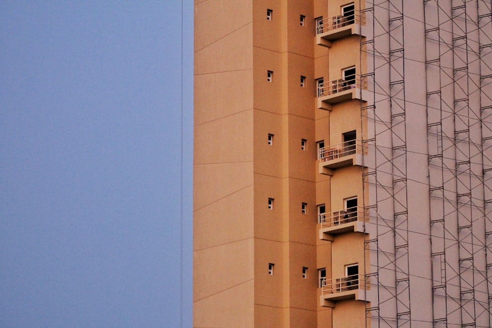 beige concrete building under blue sky during daytime