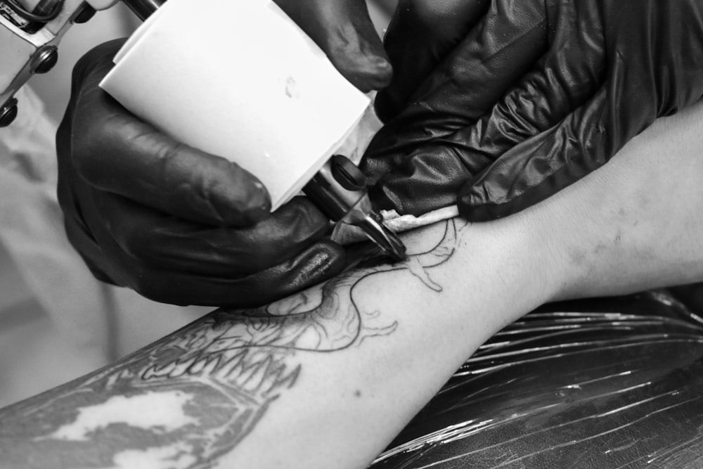 person holding white ceramic mug