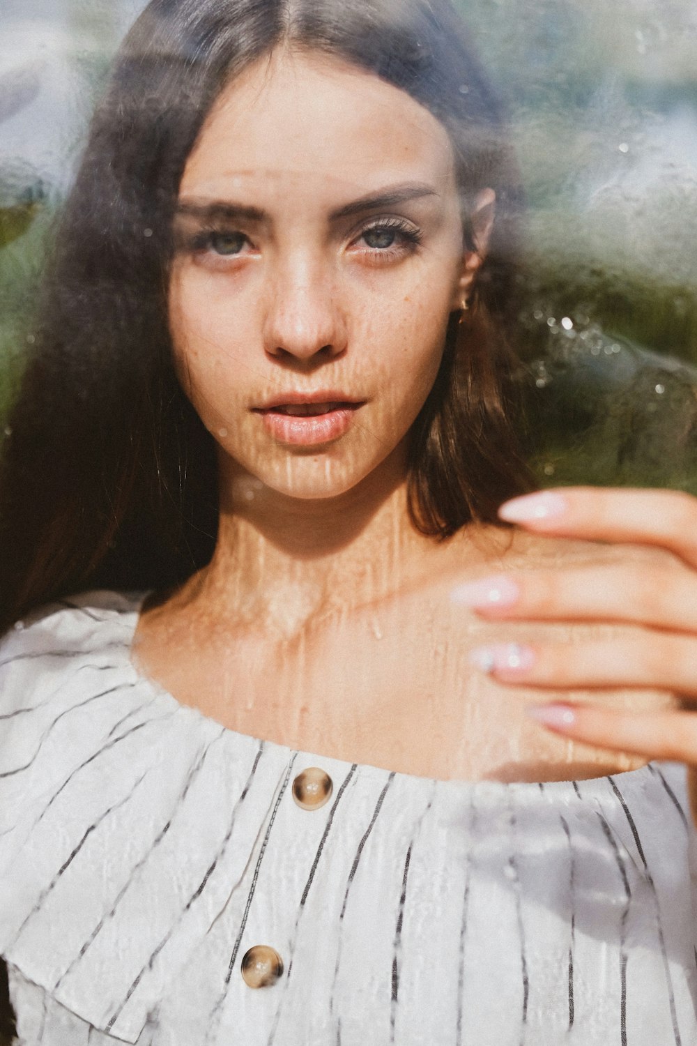 woman in white and black striped shirt