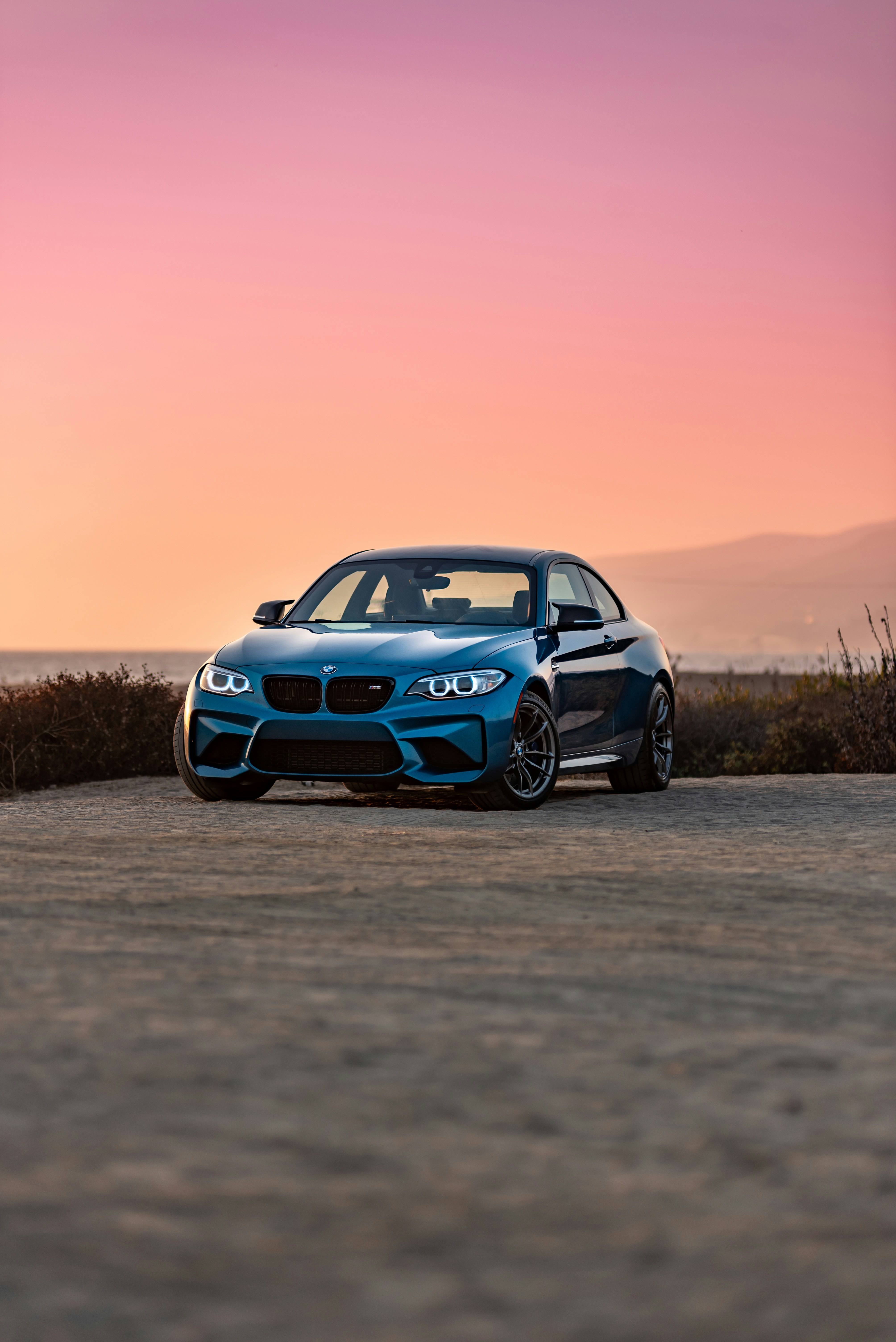 blue-bmw-m-3-on-road-during-daytime