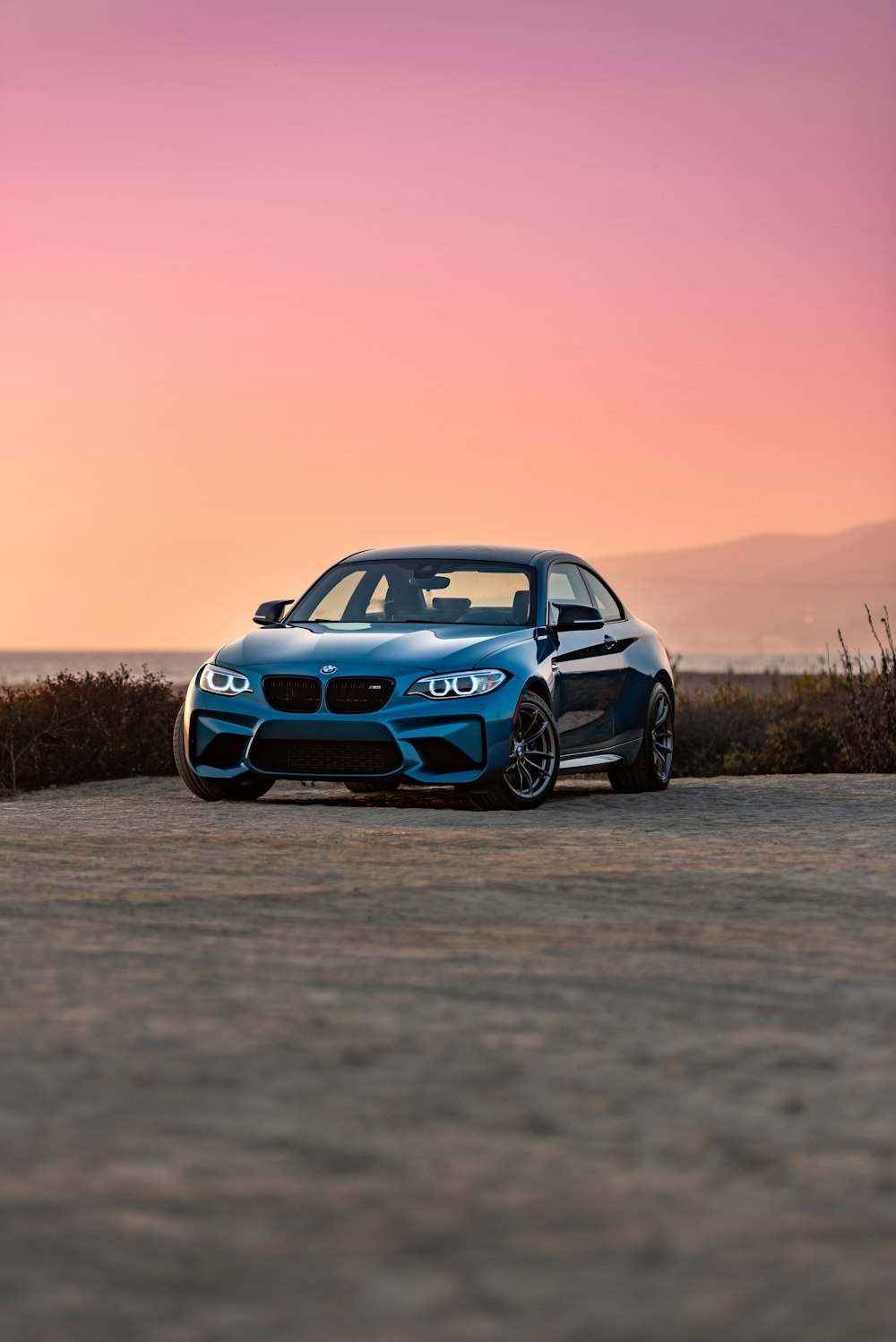 blue bmw m 3 on road during daytime